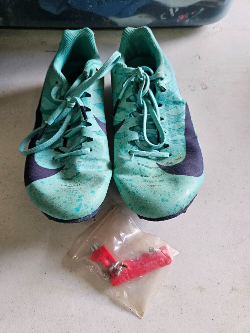 Nike track spikes with extra spikes and tool